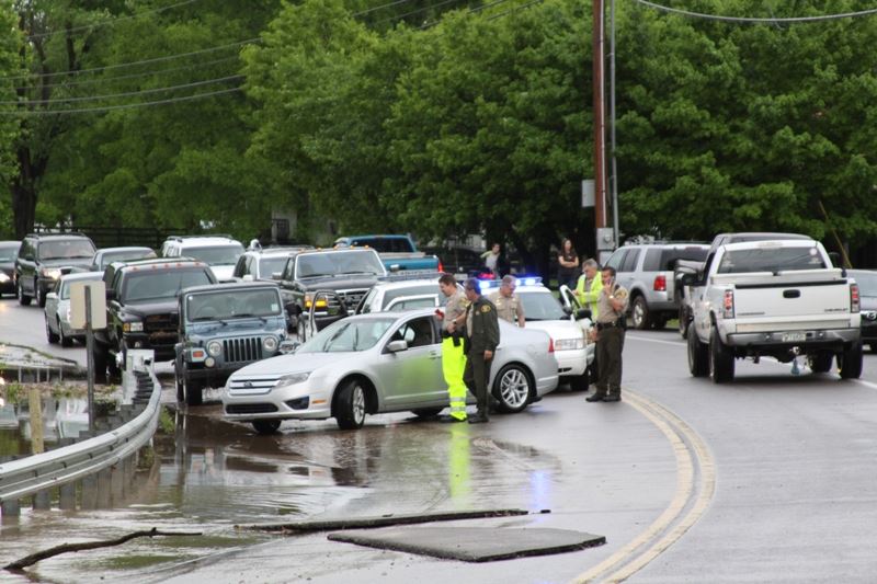 A lines of cars pile up behind a flooded road during the May 2010 flood.
